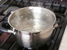 How Long Does Water Need Boiled To Be Drinkable? boiling water in a metal pot