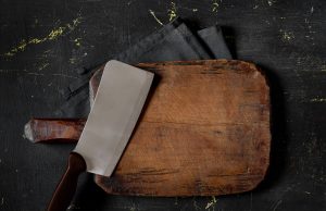 How to Take Care of a Wooden Cutting Board metal cleaver and wooden cutting board