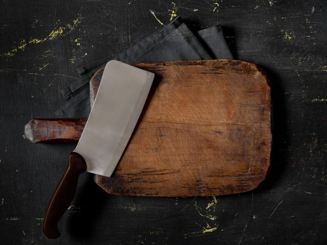 metal cleaver and wooden cutting board
