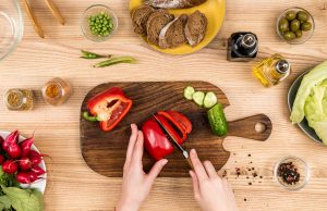What is the Safest Way to Cut With a Knife? woman cutting a red pepper